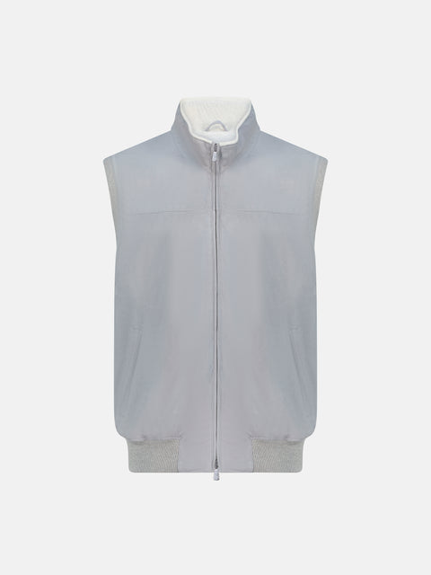 Gray vest with a white shirt underneath on a light gray background