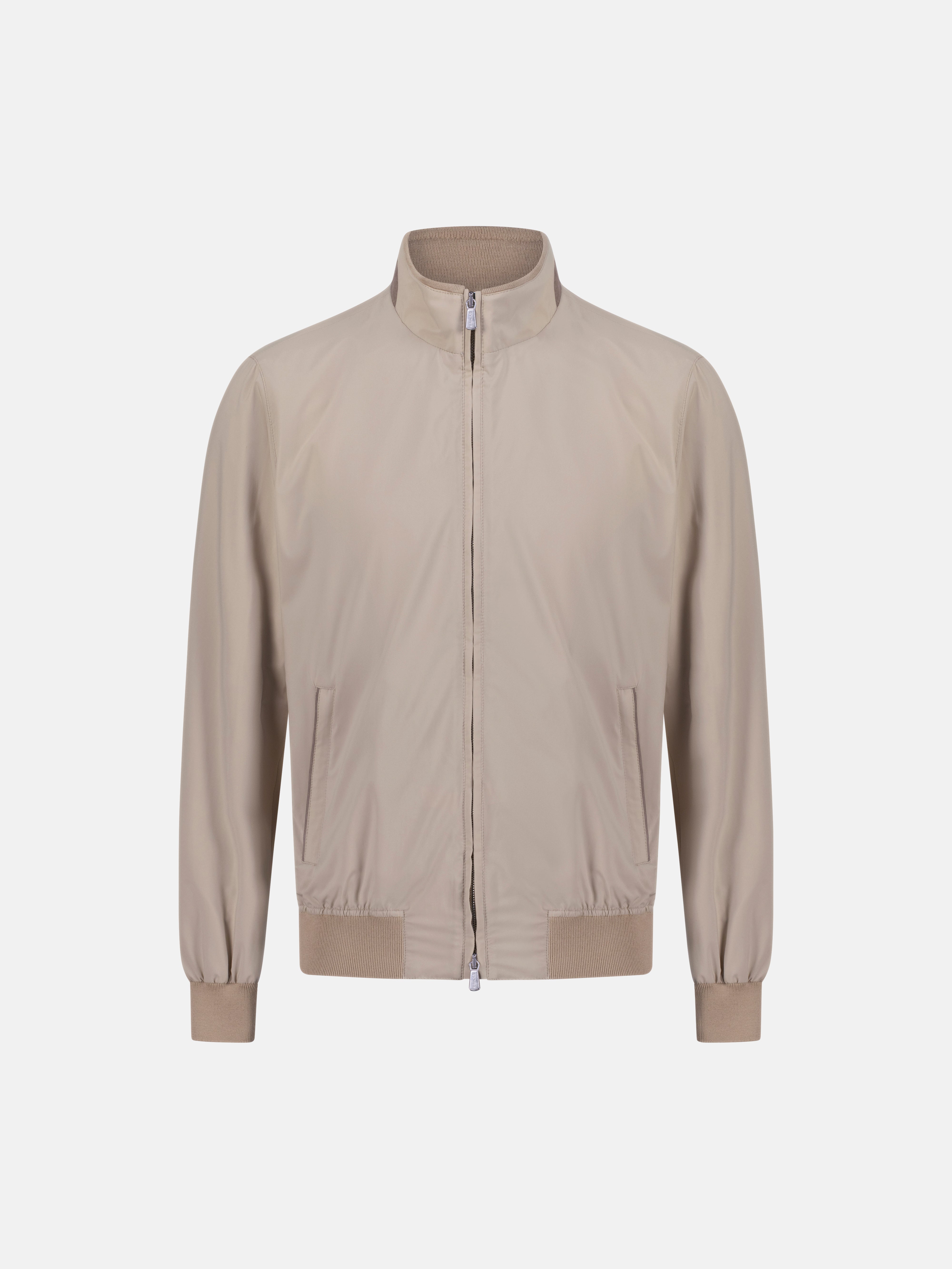 Beige bomber jacket on a light gray background